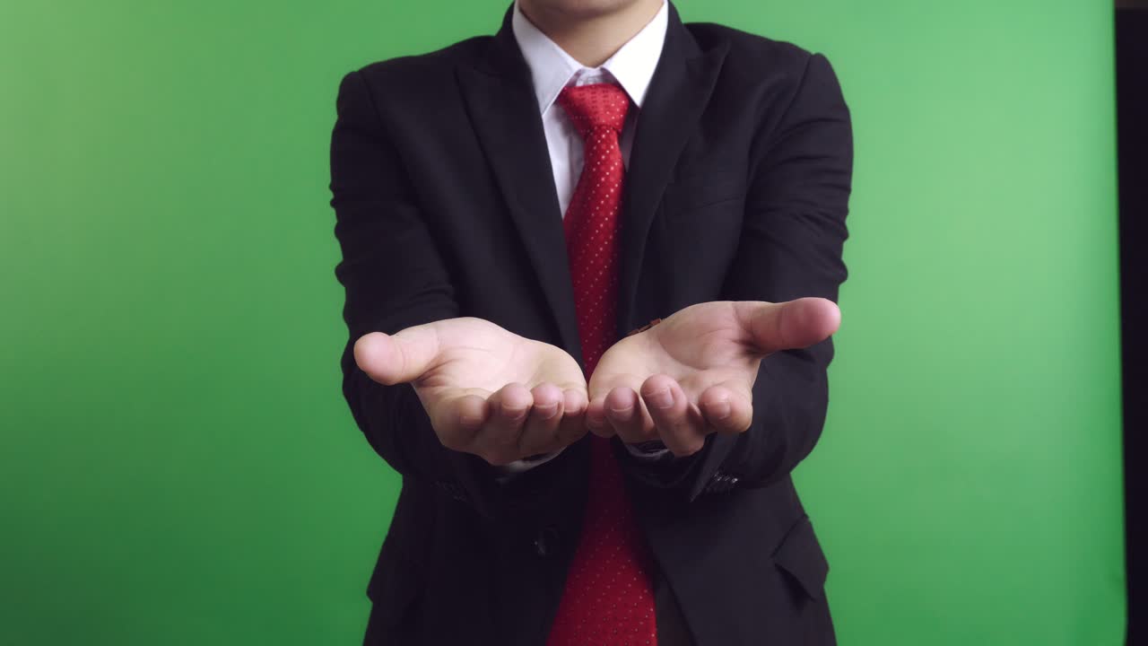 Businessman with Open Hands on Green Screen