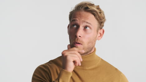 young man thinking and pointing up