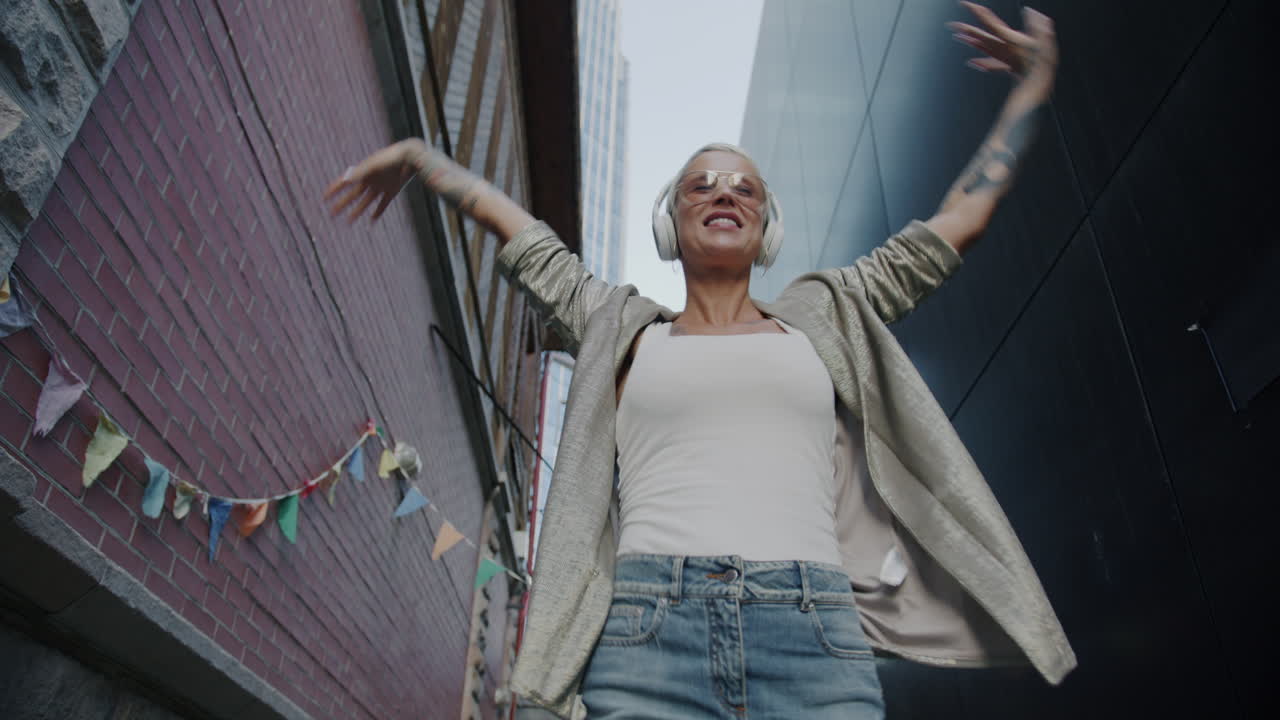 Happy Woman Dancing in the City
