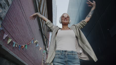 happy woman dancing in the city
