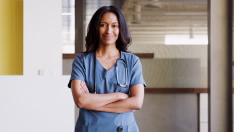 middle aged female doctor wearing scrubs