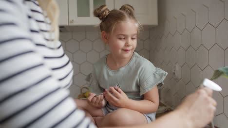 close up video of mother and daughter cooking together