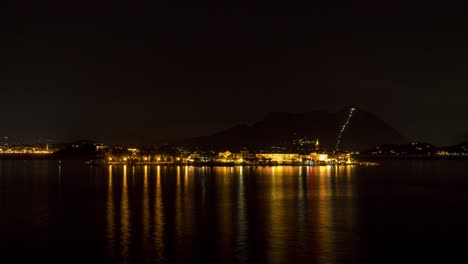 a night time time lapse of passing boat traffic on the island of pescatori on the italian lake maggiore