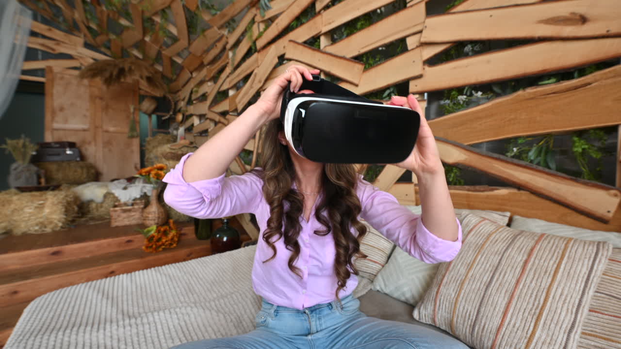 Woman putting on VR headset and enjoying it