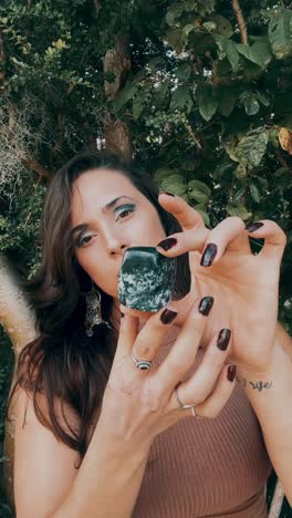 woman holding crystals outdoors