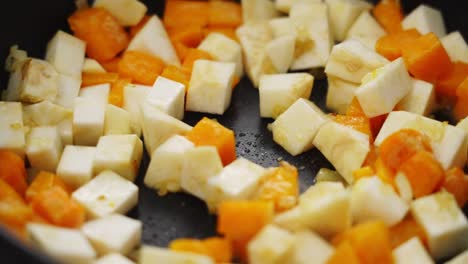 Crop-person-adding-celery-to-stew