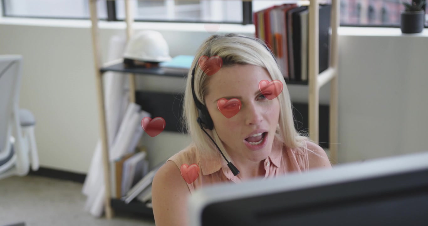 Animation von digitalen Symbolen über einer Geschäftsfrau, die einen Laptop benutzt