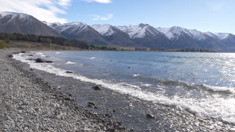 waves at lake ohau in mackenzie basin, south island, new zealand - wide shot