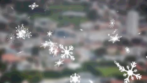 Animation-of-falling-snow-over-blurred-cityscape