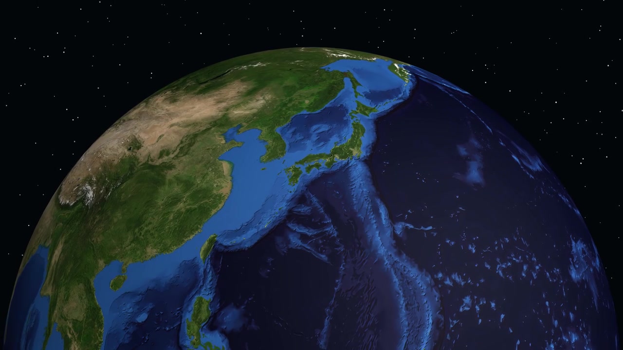 Un'animazione digitale zooma dallo spazio profondo verso la Terra, individuando Fukuoka, Giappone, con testo