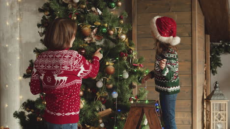 happy family decorating christmas tree at home 3