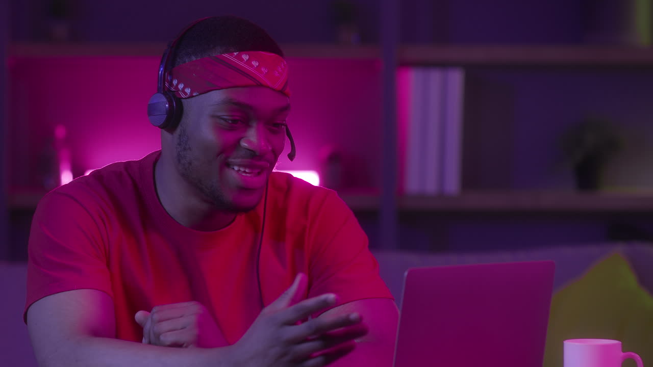 Man Gaming and Video Calling at Night