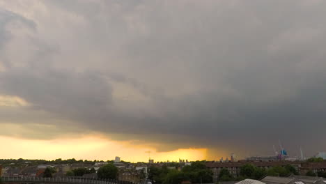time lapse: sunset and heavy rain with colourful clouds above london landmarks