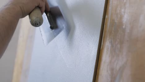 plastering a wall