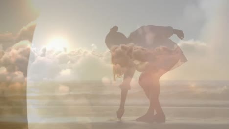 Animation-of-clouds-over-caucasian-woman-walking-on-beach