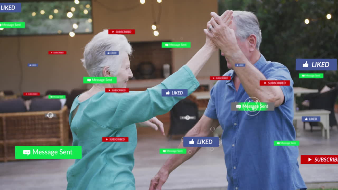 two seniors dancing and high-fiving on patio, featuring floating social media icons for marketing