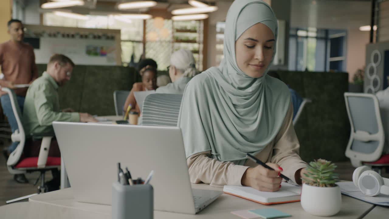 Woman in Hijab Working on Laptop in Modern Office | Premium Stock Video ...
