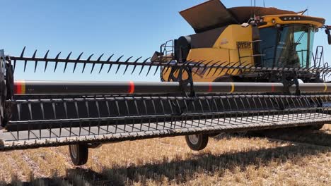 This-footage-captures-the-synergy-of-modern-agricultural-technology,-showcasing-the-essential-role-of-header-fronts-in-the-wheat-harvesting-process