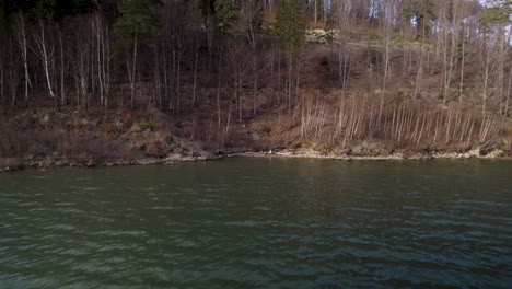 Aerial-Shot-of-Boy-Fishing-in-a-Lake