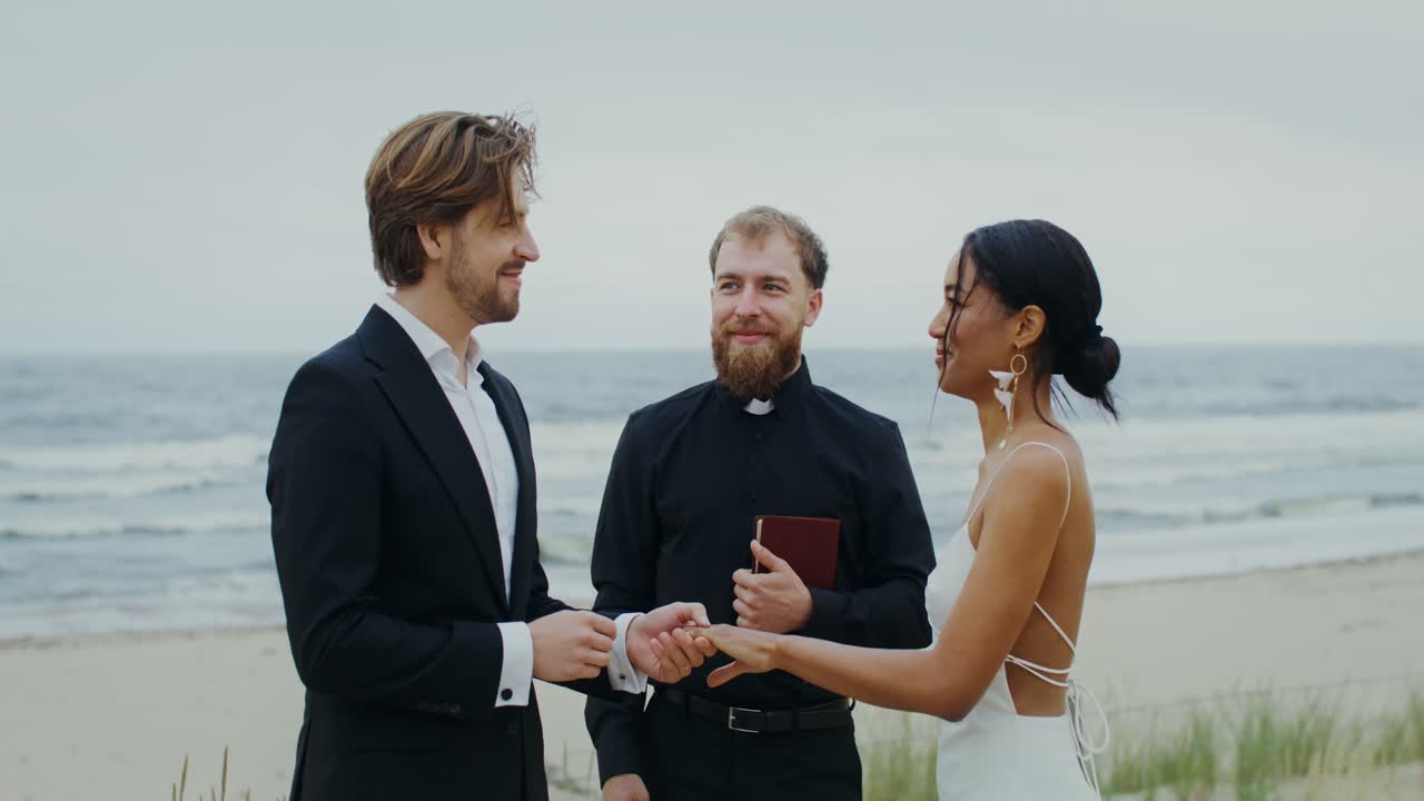 Beach Wedding Ceremony with Interracial Couple and Officiant