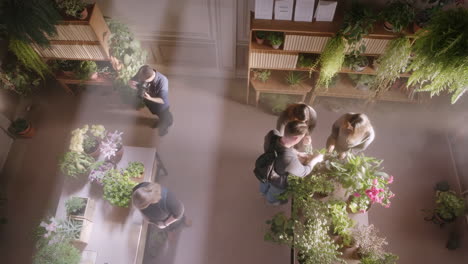 people in a modern indoor plant shop
