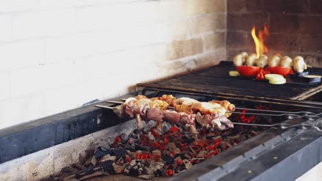 meat on grill on skewers. close up of roasted meat cooked at barbecue