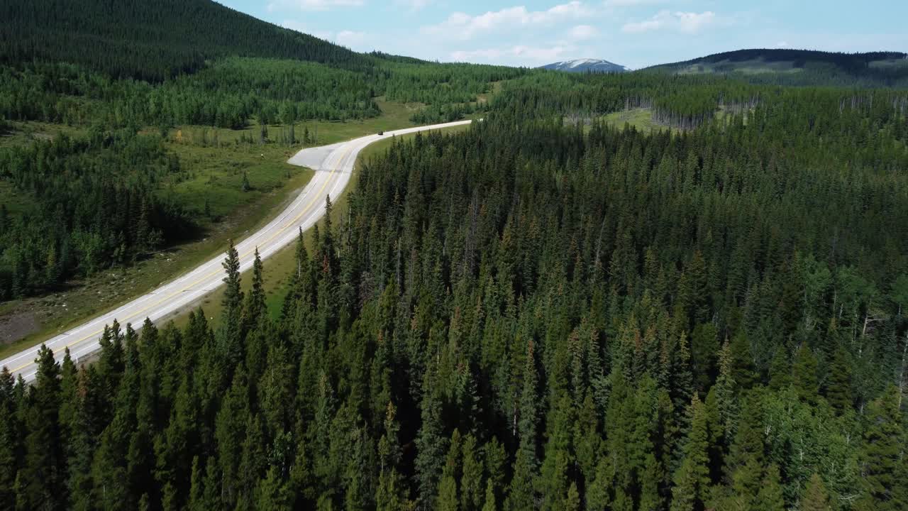 Lonely car driving on Route 66 Alberta Public Land Use Zone