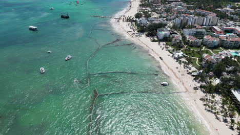 aerial drone view of boats and resorts on a tropical panama beach