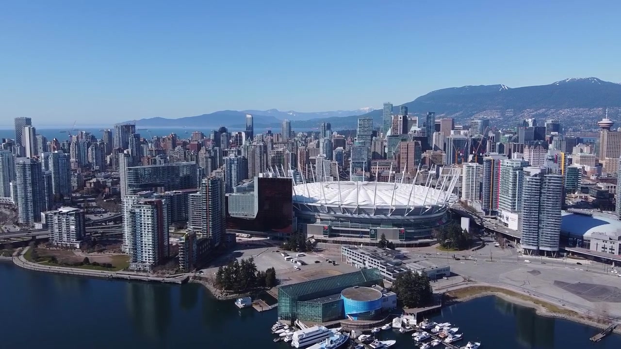 Aerial of Downtown Vancouver with BC Place (Truck Left and Boom Up)