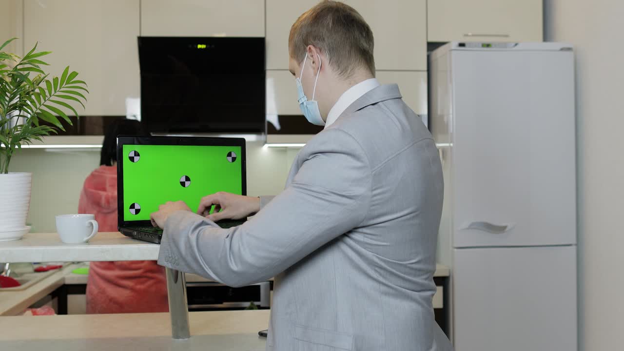 Quarantine. Businessman working on laptop at home office. Coronavirus