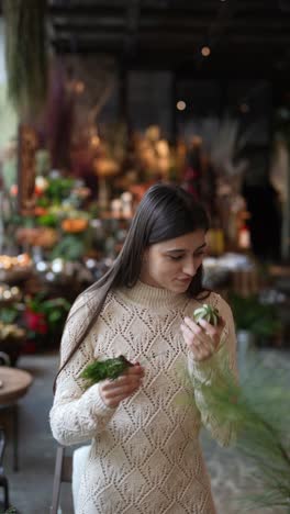 woman choosing christmas decorations