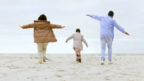 Family-on-beach,-playing-and-parents-with-child