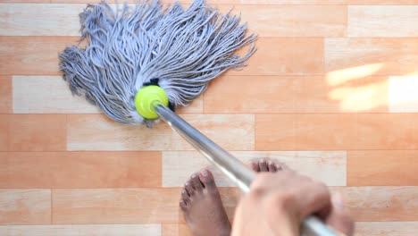 person mopping a floor