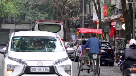 vehicles and pedestrians navigating a crowded street