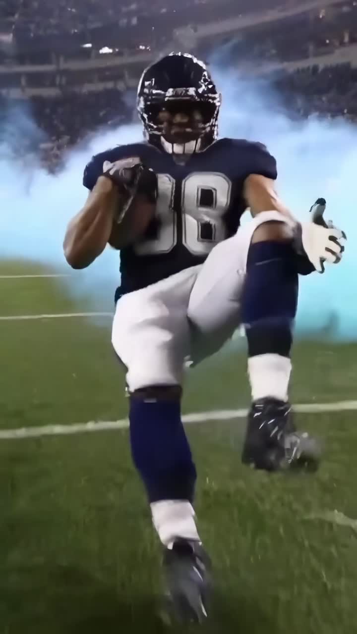 Ripresa video dinamica dal basso di un calciatore che corre sul campo con fumo blu