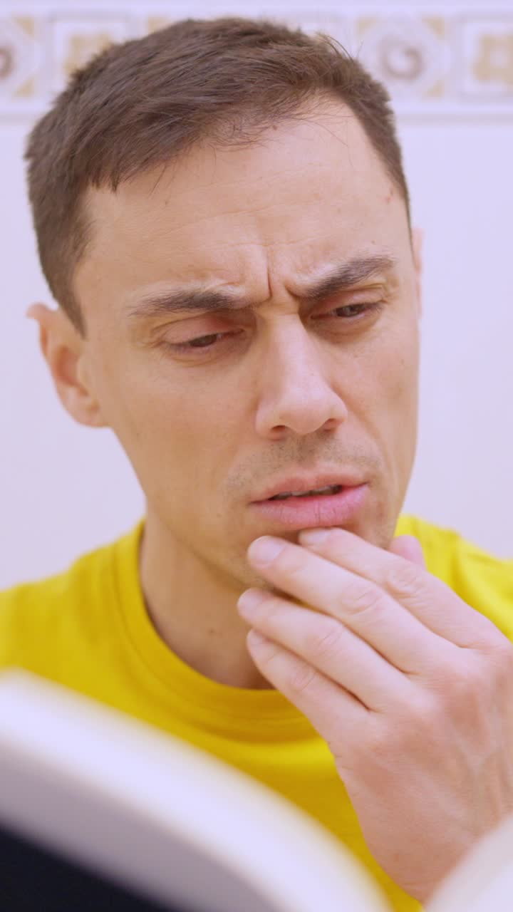 Man reading a book on the toilet