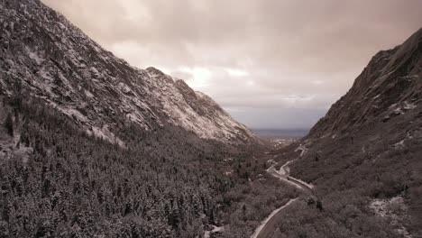 Sun-Peaking-through-snowy-canyon-in-Utah