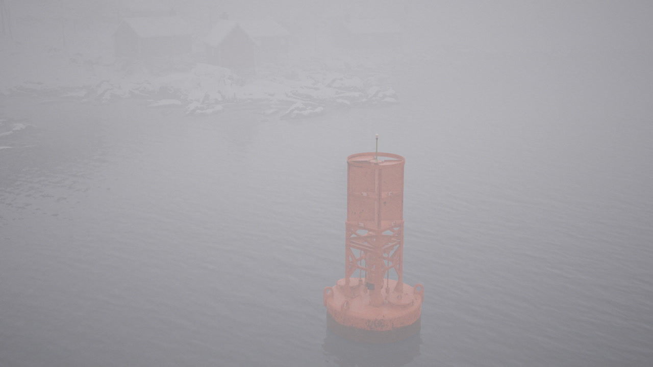 Foggy day with a navigational buoy visible in a harbor setting