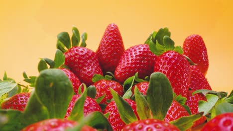 pile of fresh strawberries on table