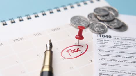 tax time: calendar, form 1040, and coins