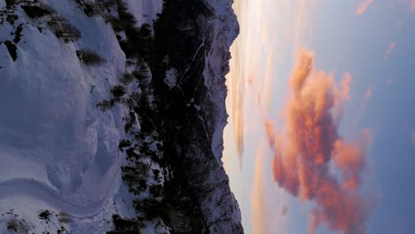 flying over valmalenco dolomites alpine mountains at sunset or sunrise in valtellina, italy