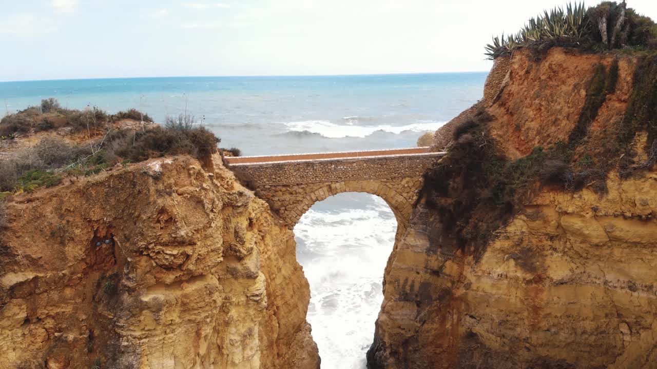 Man made arch bridge, Praia dos Estudantes beach, Lagos, Portugal