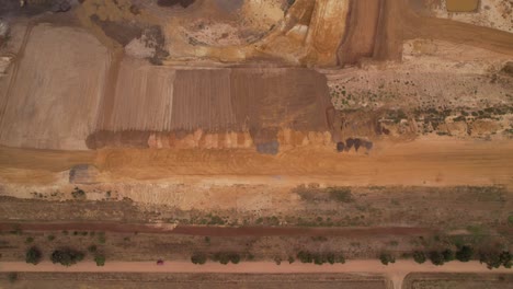 Open-pit-coal-mine-top-down-aerial-flyover