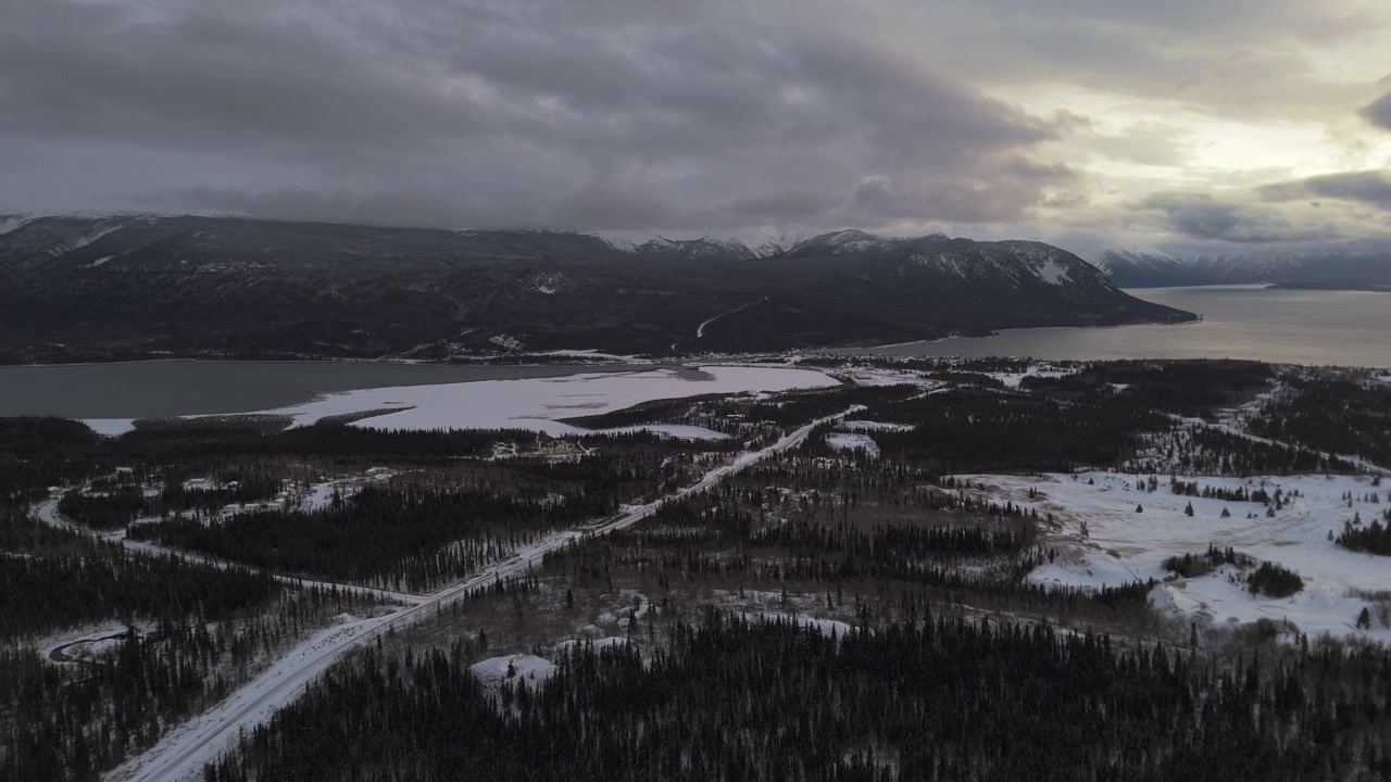 Deserted Forest Park And Bennett Lake Near Carcross Town During Winter In Yukon, Canada. Aerial Drone Shot