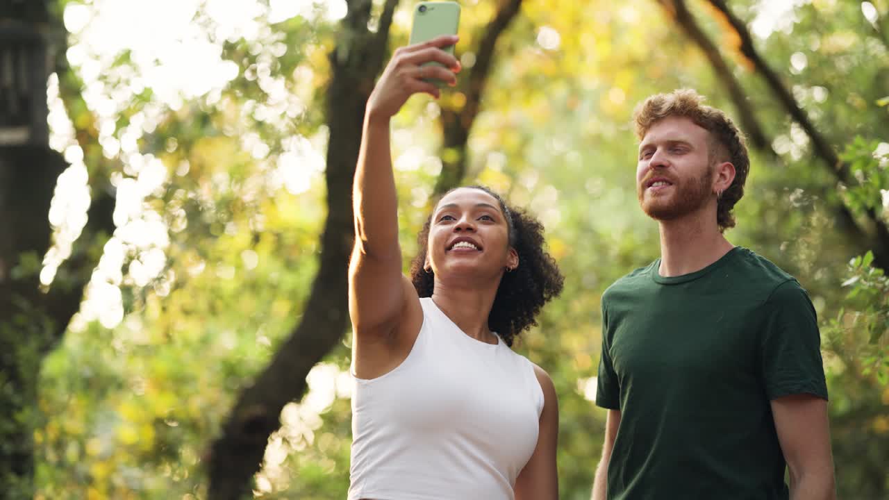 Couple taking a selfie in the forest