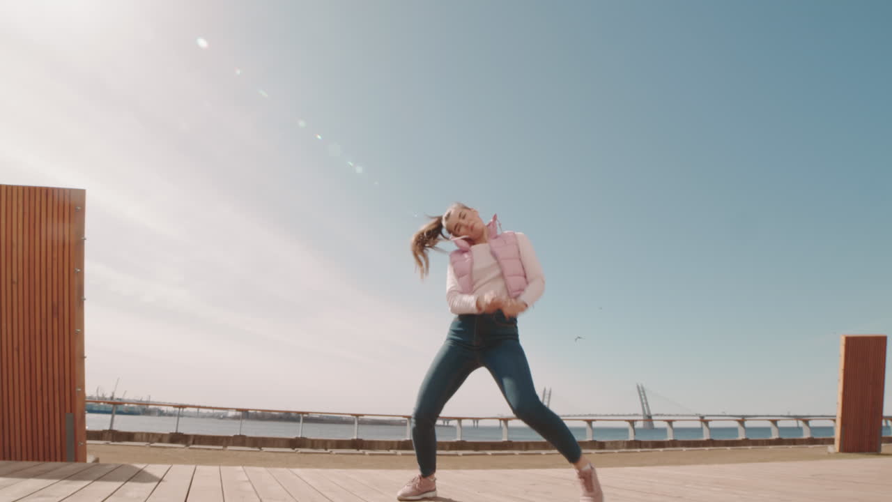 Young Woman Dancing on Deck
