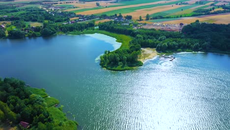 epic top down aerial view of big lake with clear blue water