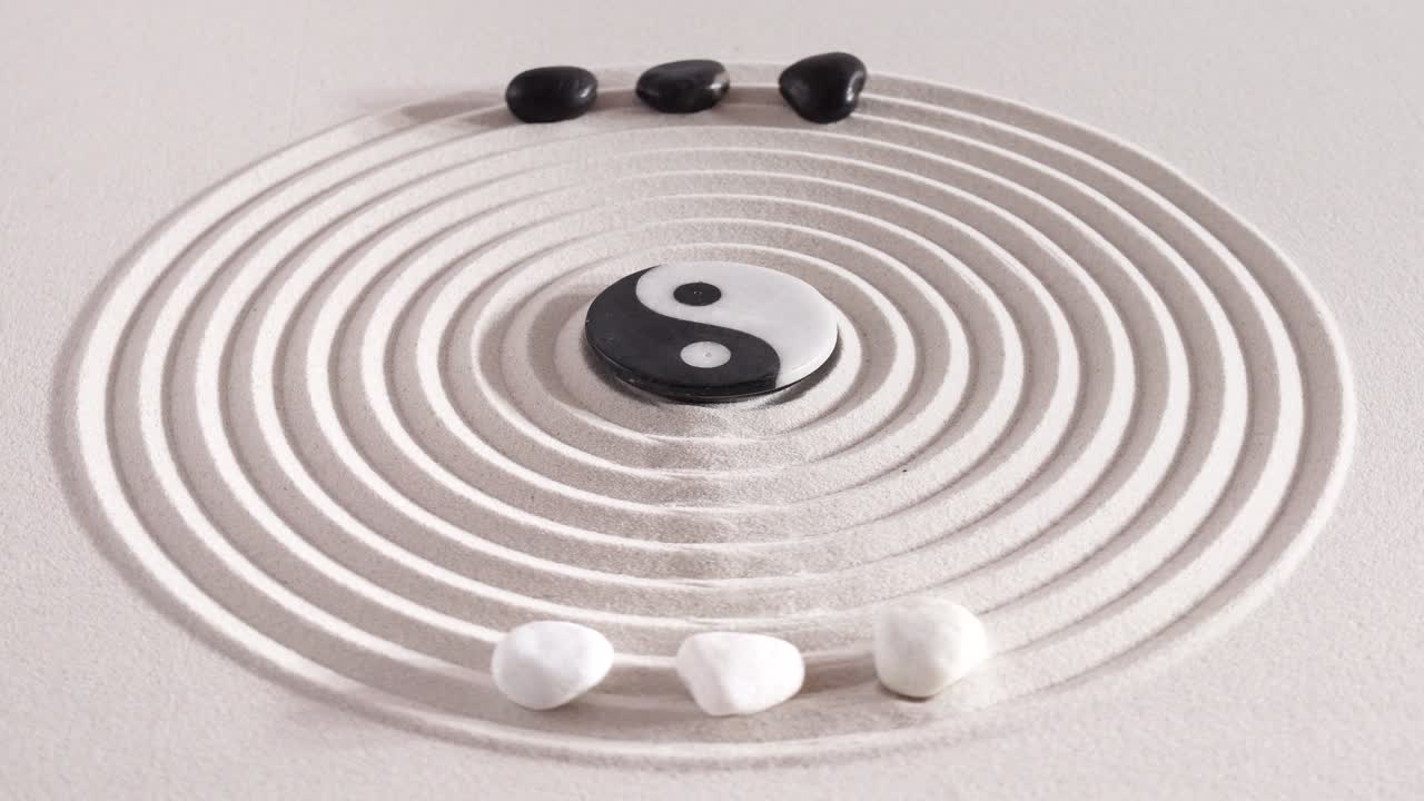 Japanese ZEN garden with yin yang stones in textured sand