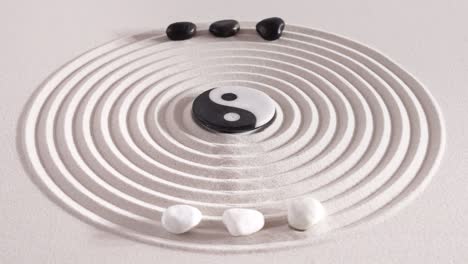 japanese zen garden with yin yang stones in textured sand