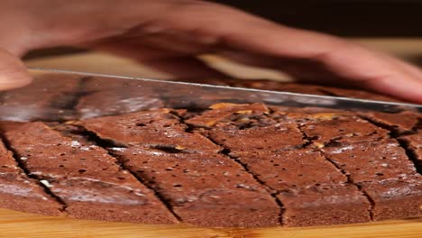 slicing a chocolate cake